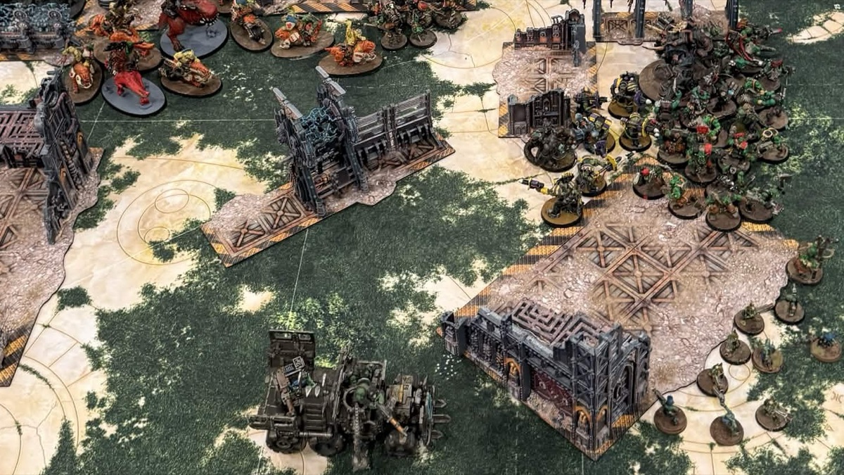 Two armies mid game on a green tournament table at the World Team Championships