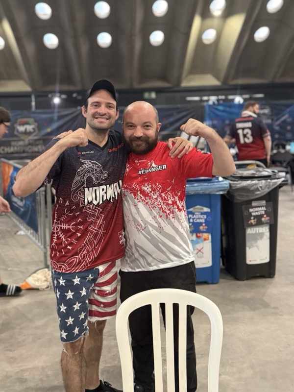 Jonathan Arkin and an opponent after a game on the tournament floor